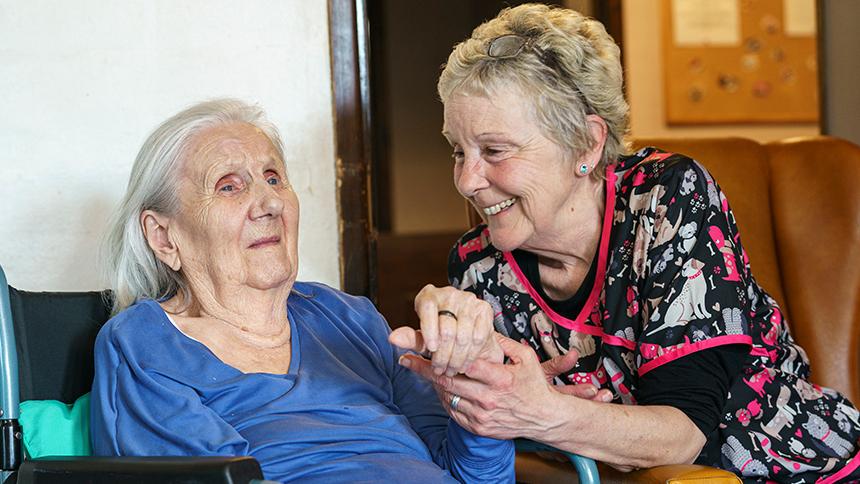 A care home resident takes part in a live music session