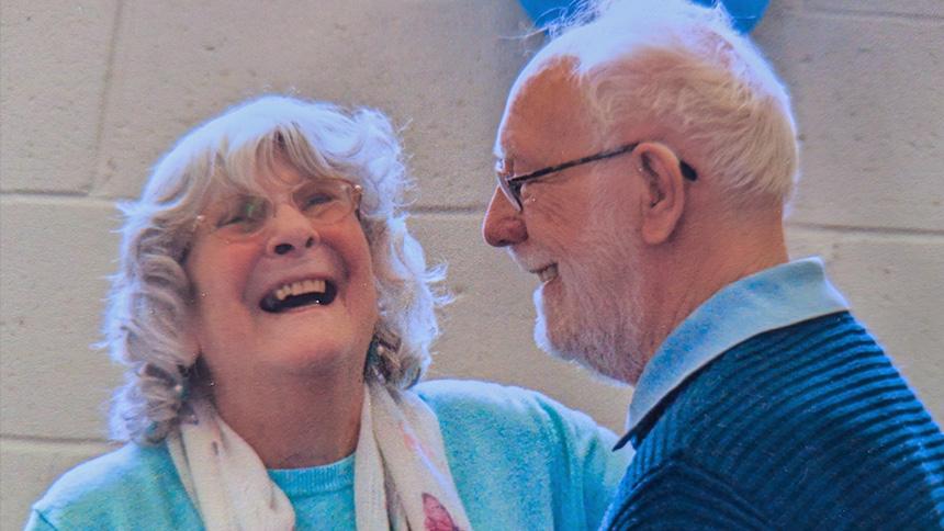 Brenda laughing as she dances with her husband Alan