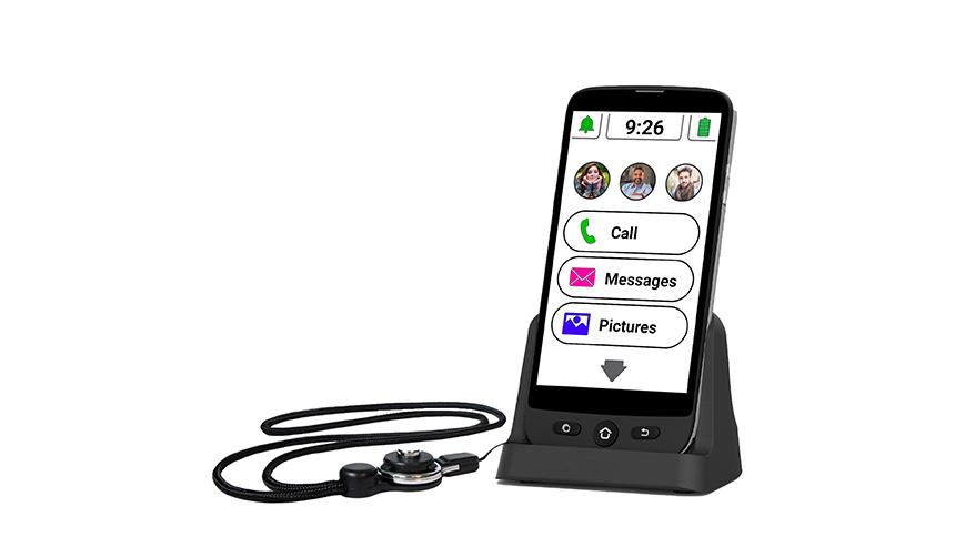 Black smartphone on a charging base with a black charging cord.