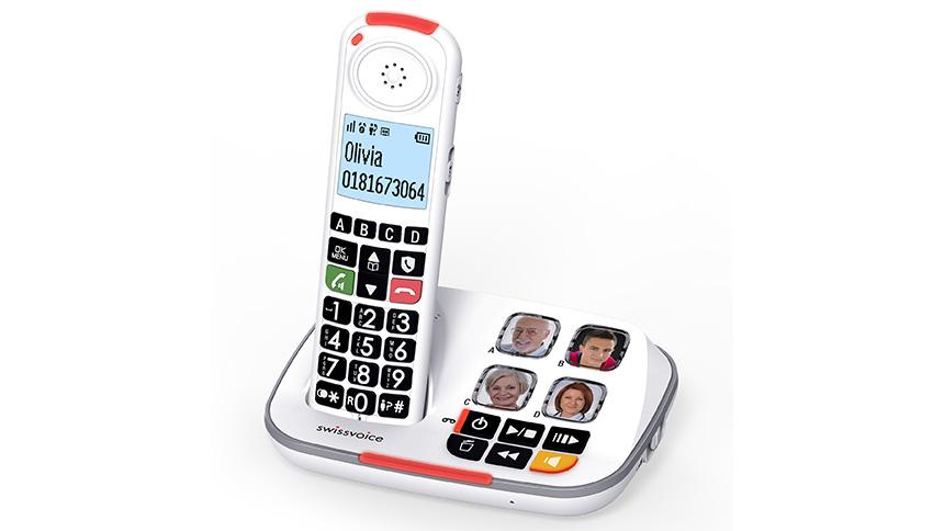 White cordless phone stood on base with big buttons and photo buttons