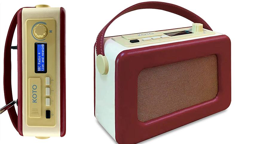DAB radio in burgundy colour, it has a handle and a digital display on the top