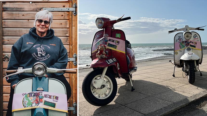 Alison Bowen sat on her vintage scooter. She is wearing a black hoodie and sunglasses, and there's a wooden fence behind her. Red and white vintage scooters parked on a path next to a beach.