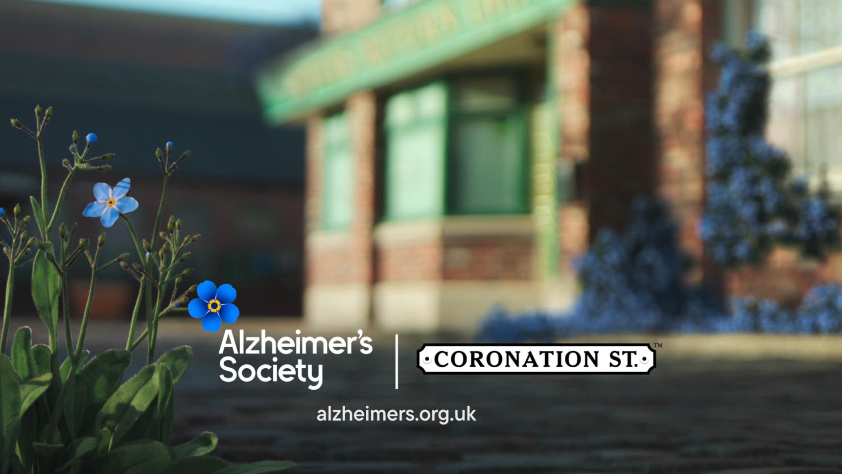 The Rovers Return blurred in the background and in the left bottom corner, some forget-me-nots