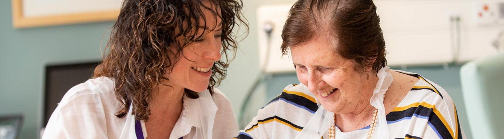 Two women smiling together