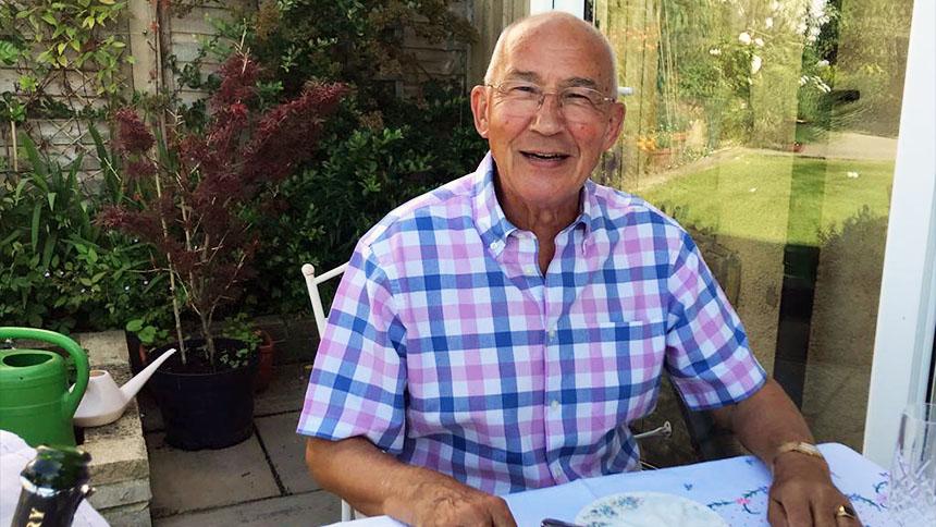 Neil Cutler sitting in a garden