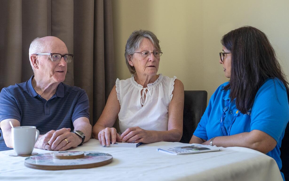 Liz and Jim Rose talking to Dementia Adviser Kiran
