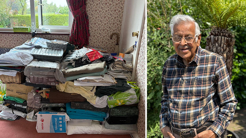 Piles of Bulu's paperwork in folders and plastic bags, and Bulu smiling, he is wearing a checked shirt.