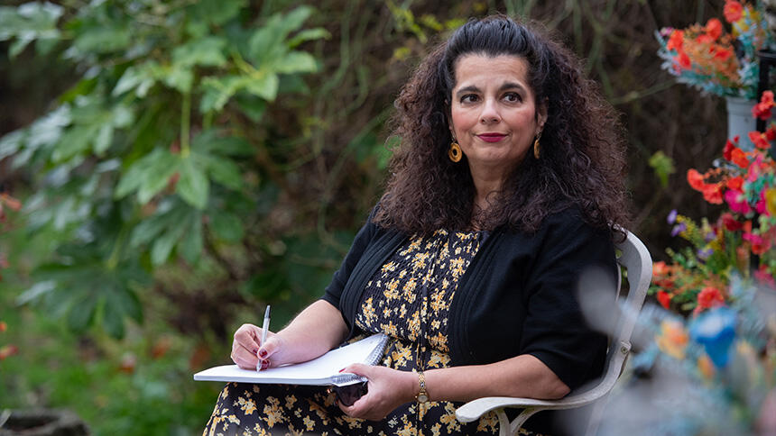Lorena in her garden, writing