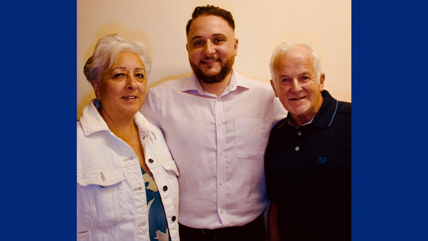 Linda is wearing a white denim jacket, she's stood next to her nephew Ashley and friend Ken.