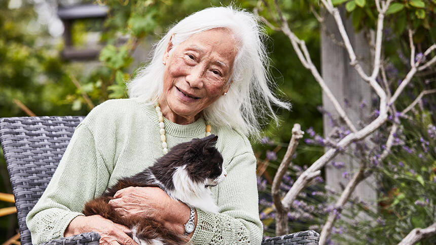 Annie Chinfen sitting with a cat in her lap