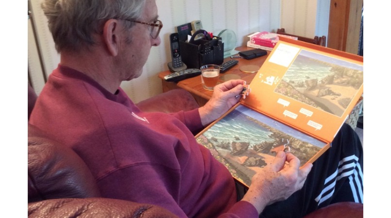 Keith Oliver doing a puzzle