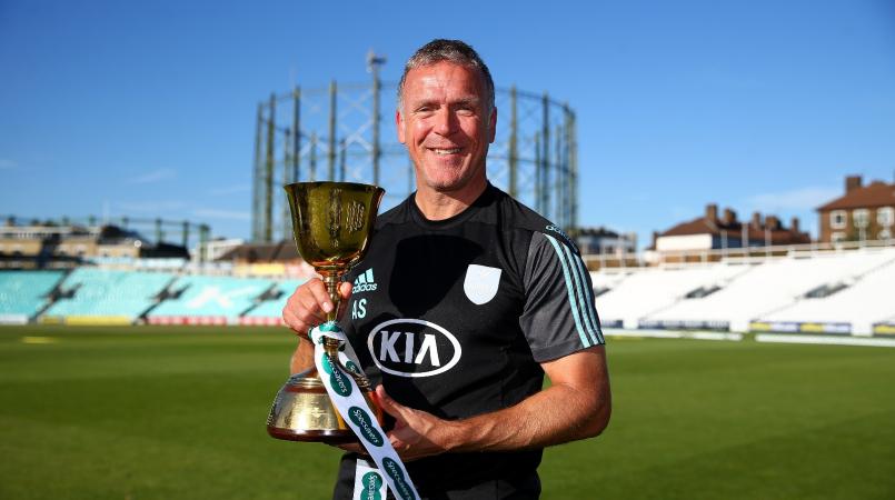 Alex Stewart holding a trophy