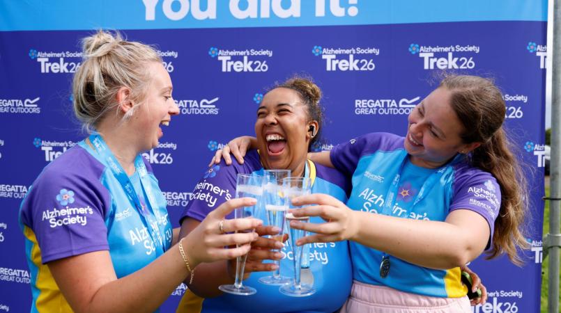 3 trekkers celebrating with prosecco 