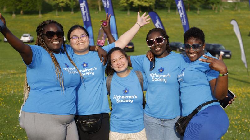 Volunteers in a field at a Trek26 event