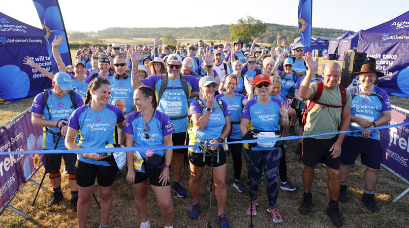 A large group of people waiting at the start line of a trek26.